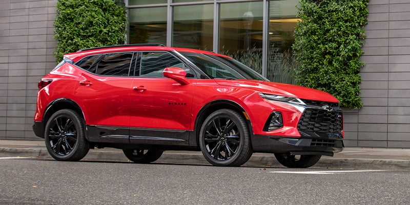 Red 2019 Chevy Blazer in urban downtown