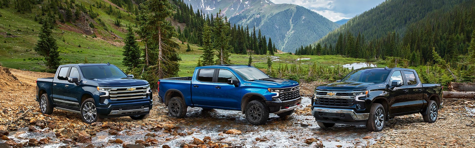 Blue 2022 Chevrolet Silverado in the rocky mountains